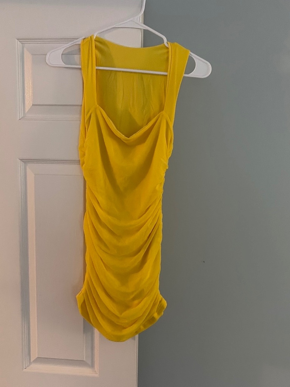 Adorable, yellow mini dress perfect for a special occasion